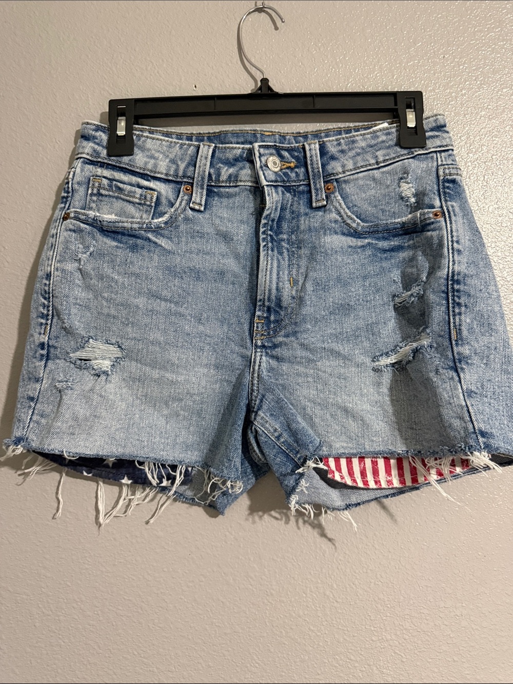 Old Navy high rise Light Blue Distressed Denim Shorts w/American flag on pockets